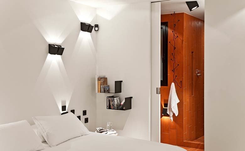 Urgell Apartment — Sleeping area and bathroom