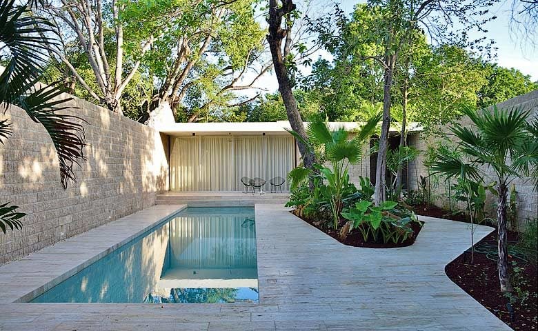 La Tropical — Bedroom wing of the house with pool